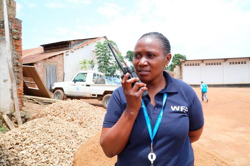 Lucy Laisi holding a walkie-talkie