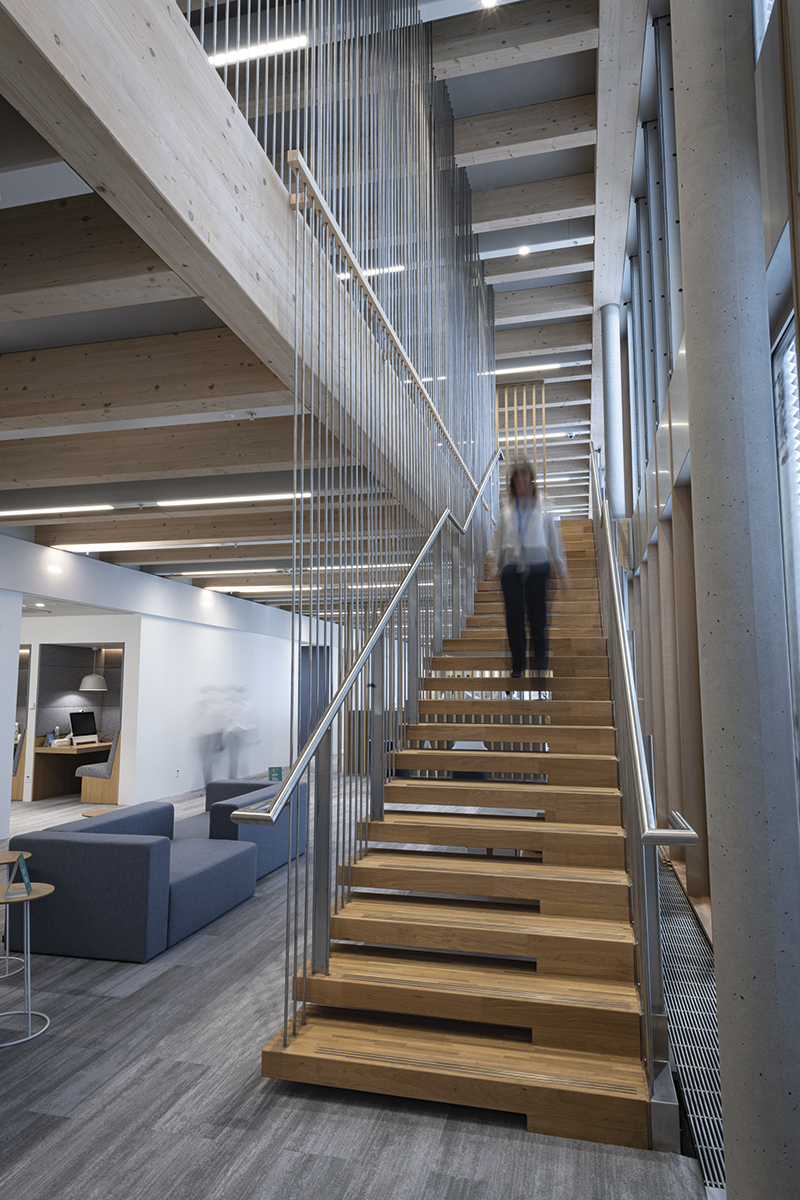 Employees moving around the new office building.